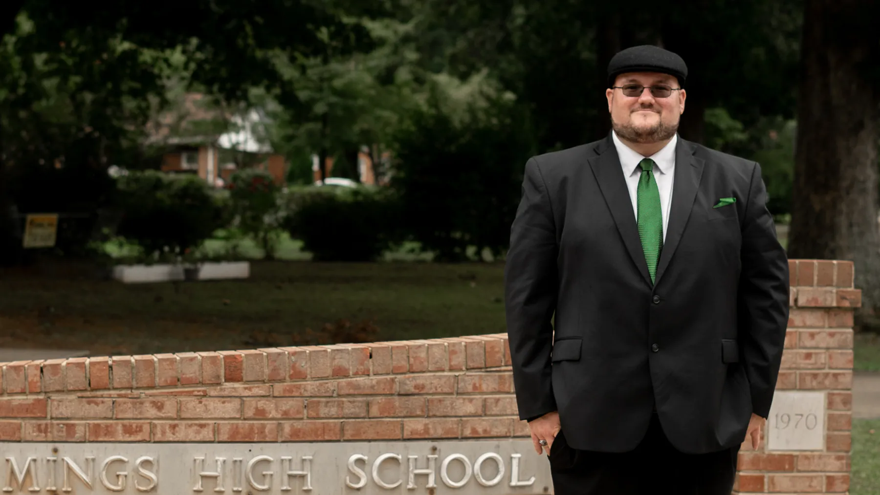 John Coleman standing outside a high school