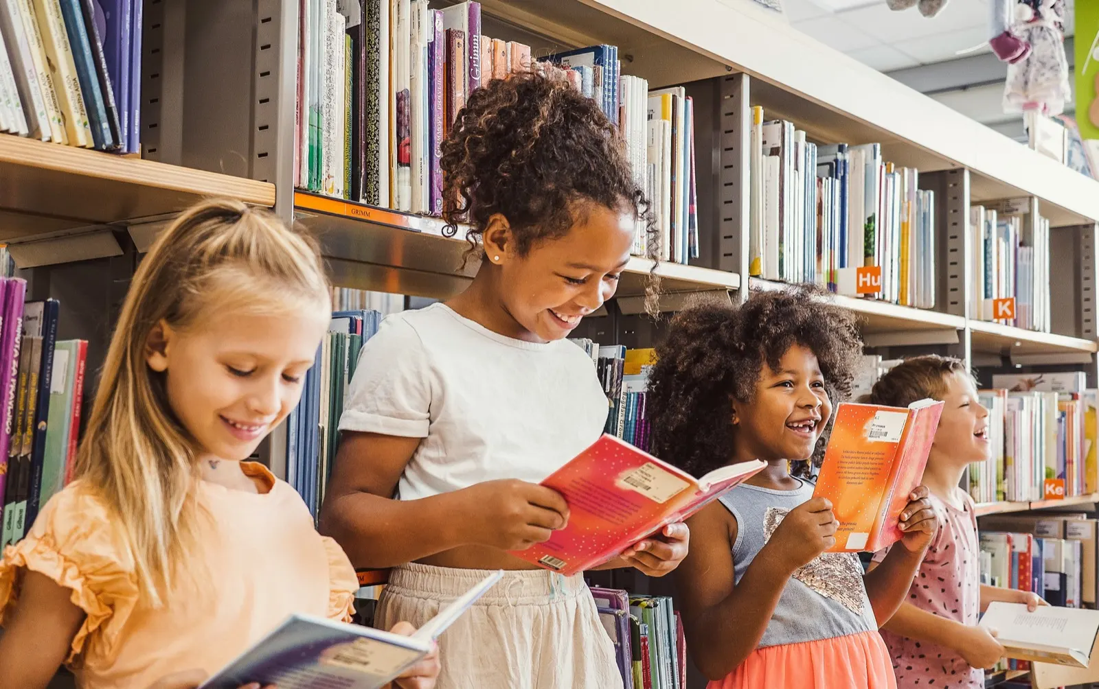 Children reading books in a school library